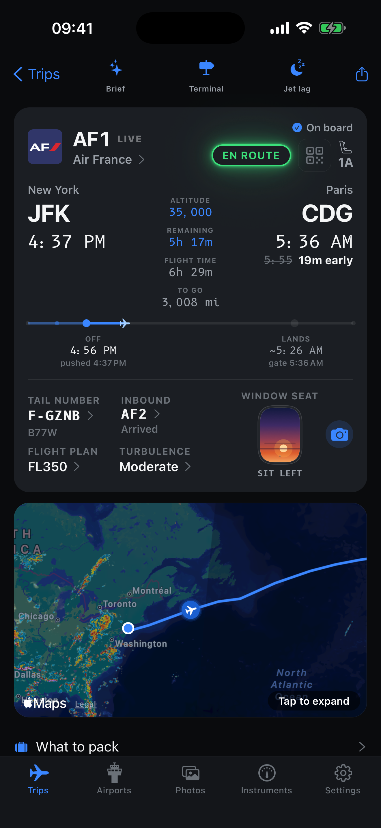 Air France AF1 from New York JFK to Paris CDG, showing flight progress, altitude, arrival estimate, window-seat advice and a route map. Captured example in night mode.