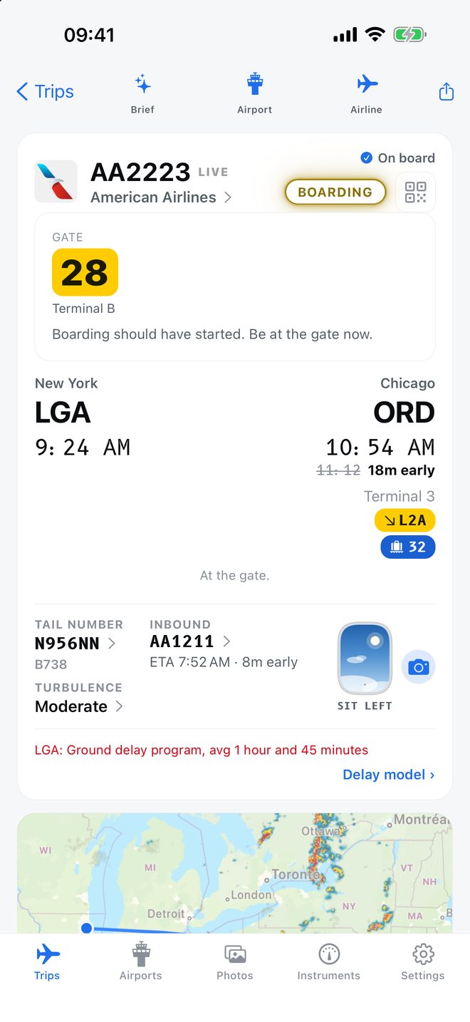 The flight screen while AA2223 boards at LaGuardia: gate 28 is the largest thing on it.